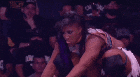Lady Wrestler Athena Hitting Her Finisher