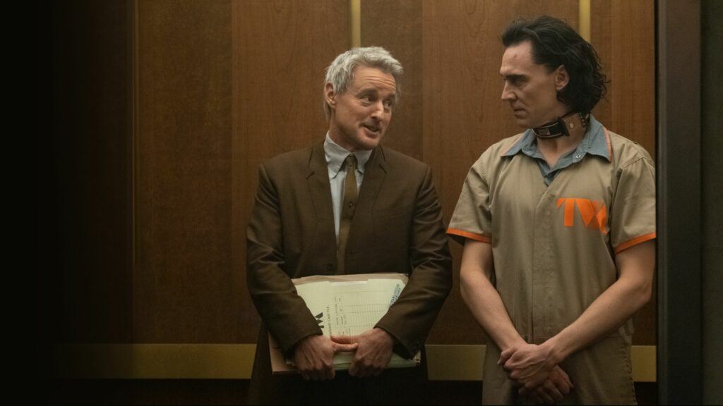 Mobius and a very annoyed, prisoner Loki in an elevator at the TVA.