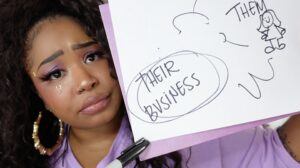 Tiffie Starchild holding a folks outside their business sigh