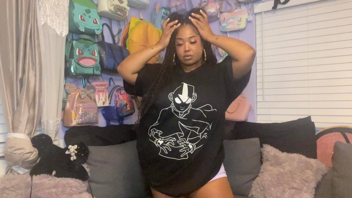 Tiffie Starchild in BlackMilk Aaang t-shirt