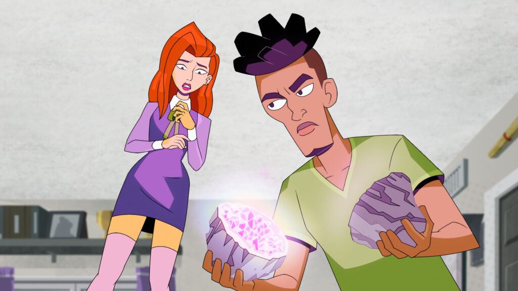 Norville and Daphnee looking at a crystal