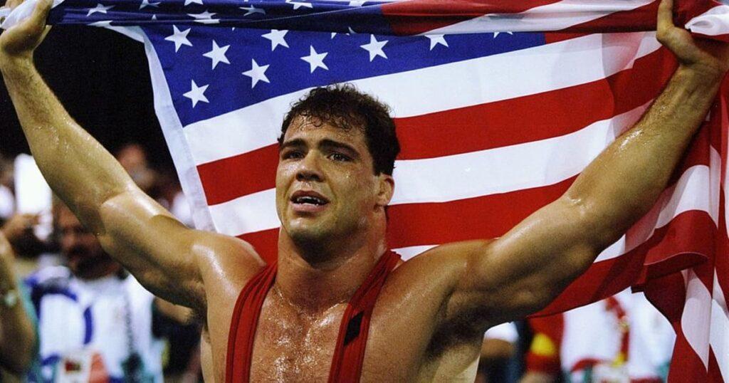 Kurt Angle at the 1996 Olympics holding the American flag